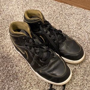 Jordan 1 Mid black and gold